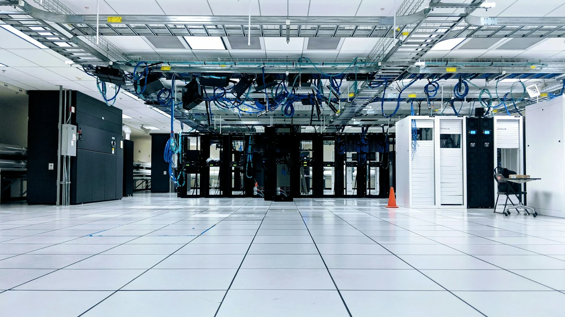 Rows of server racks in a modern data center